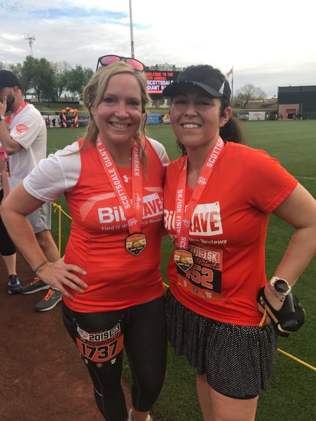 Emily waited for me at the finish line! She ran the 10k and I the 5k. Check us out representing BibRave! Go team Orange!